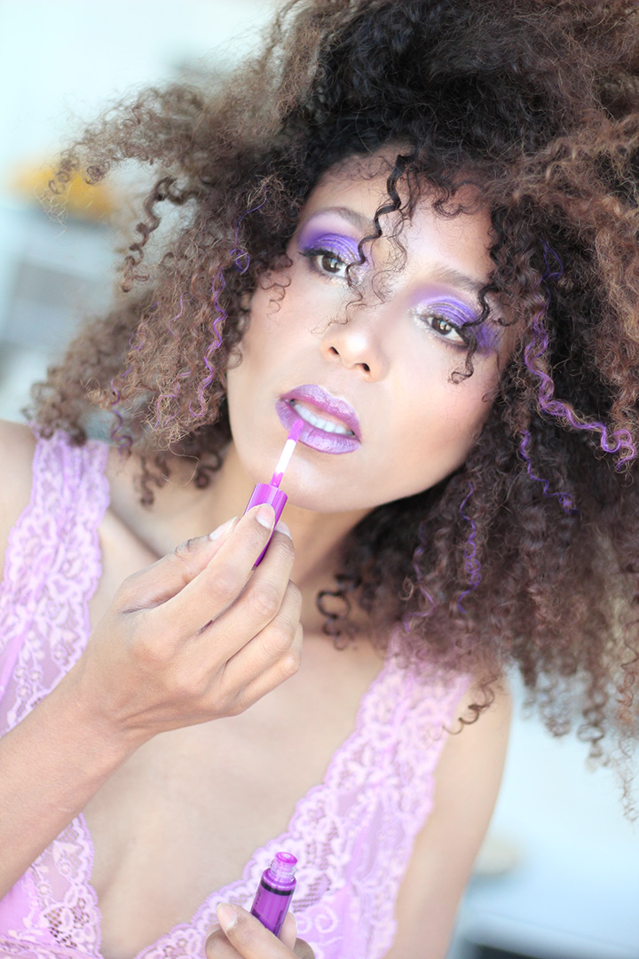 Ndoema rocks her trademark curly hair styled with Garnier Color Styler in Purple Mania, in a 