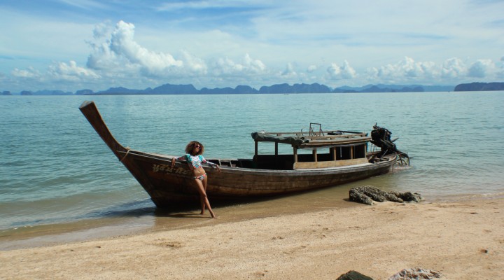 The Global Girl Travels: Picture perfect private island in the Phang Nga Bay off Koh Yao Noi, Thailand. Ndoema sports a geometric-print rashguard and bikini set with cat eye mirrored sunglasses.