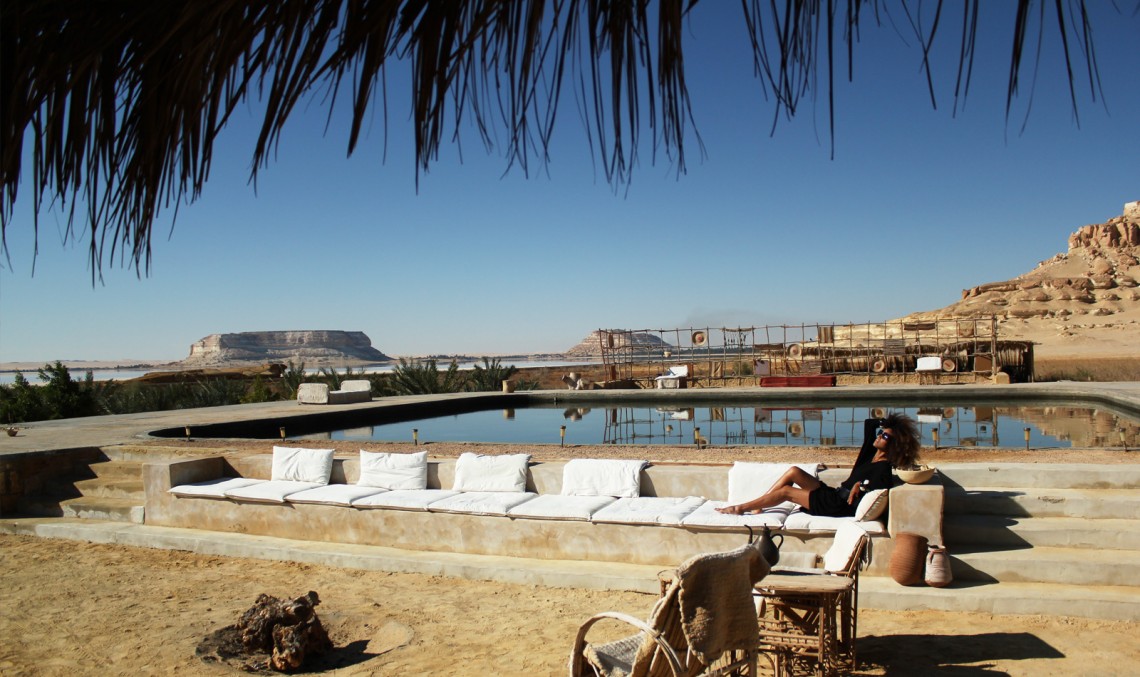 The Global Girl Travels: Relaxed and chic in a Moroccan-inspired batwing dress and tribal bracelets, Ndoema explores desert eco-chic living at luxury eco-lodge Talist at Siwa Oasis in the Libyan desert.