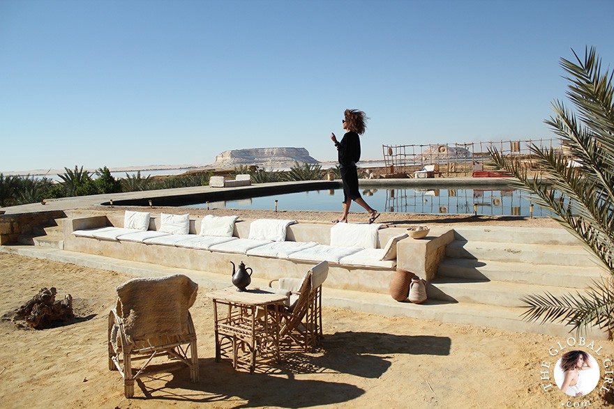 The Global Girl Travels: Relaxed and chic in a Moroccan-inspired batwing dress and tribal bracelets, Ndoema explores desert eco-chic living at luxury eco-lodge Talist at Siwa Oasis in the Libyan desert.
